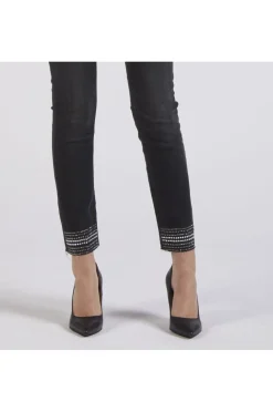 denim slim con stras al fondo grigio