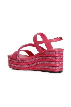 sandali asimmetrici strass e nappa con zeppa righe strass fuxia